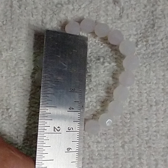 Very small plastic beads light pink stretch Bracelet - Picture 2 of 3